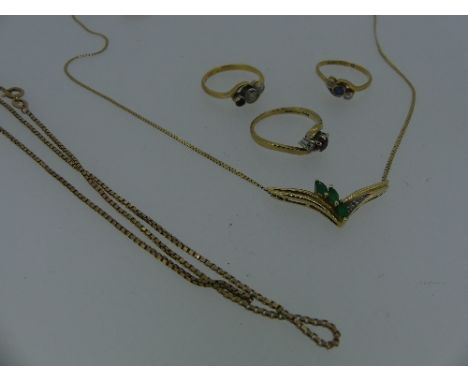 A 9ct yellow gold Pendant, of V shape, set with three oval emeralds and two diamond points, on a narrow 9ct trace chain, toge