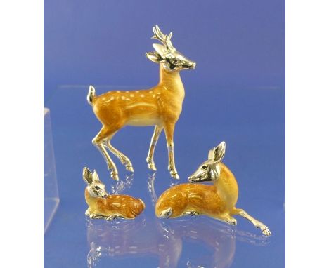 A set of three Saturno contemporary sterling silver and enamel Deer, the stag, 7cm nose to tail, 10.2cm high, with smaller re