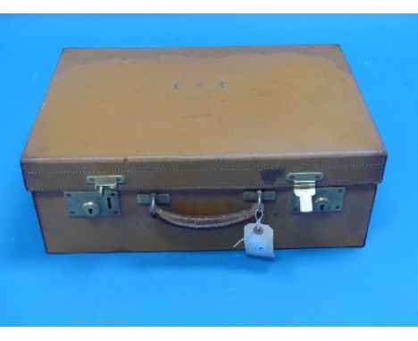 An Art Deco Period fitted Vanity Case, the tan leather case and the majority of the bottles / brushes by Alexander Clark &amp