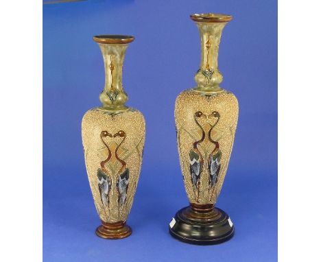 A pair of Doulton Lambeth stoneware vases, decorated by Rosina Brown, of slender baluster form, decorated with stylised birds