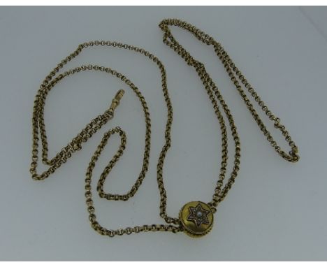 A long 9ct yellow gold Guard Chain, marked on the clip and ring, with a slide attachment, one fide floral engraved, the other