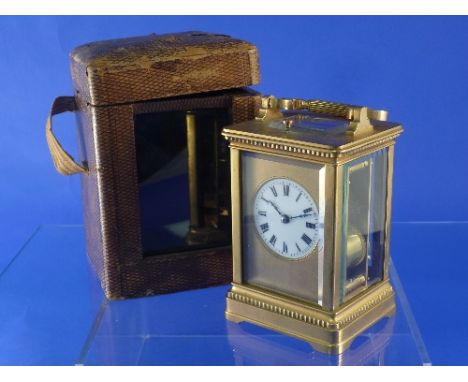 A French gilt-brass striking carriage clock with repeat, of traditional five-glass form with 8-day movement striking on a gon