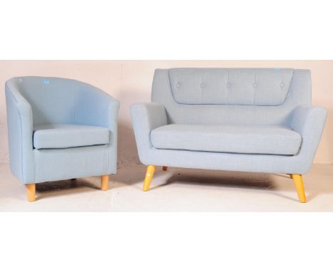 A contemporary Birlea sofa settee and tub armchair, in pale blue. The sofa features a button back design. The set having pale