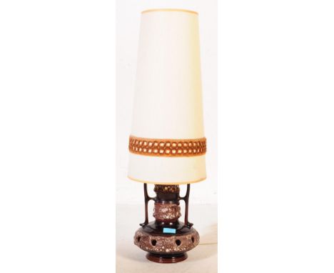 A large retro mid 20th Century West German Pottery&nbsp;fat lava lamp / light. Of bulbous form having twin handles and light 