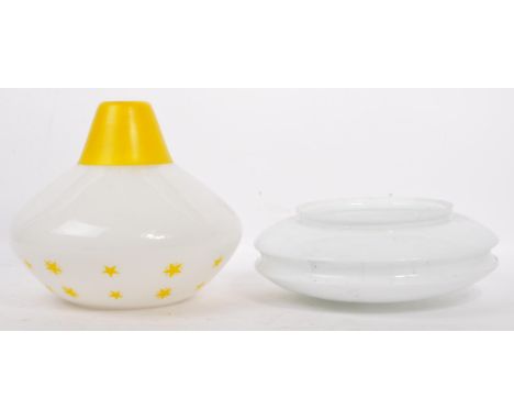Two mid century glass ceiling light shades. One of shaped form with yellow painted decoration and the other of squat form in 