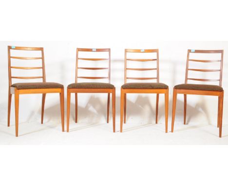 McIntosh Furniture - British Modern Design - A set of four mid 20th century dining chairs. Having ladder back rests, on uphol