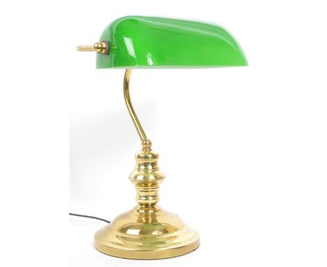 A late 20th century c1980s vintage repro banker's desk lamp / bedside light, with green shade and brass support on a stepped 