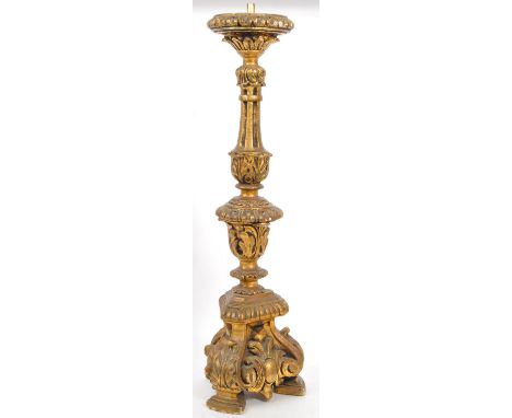 A large vintage 20th century plaster converted lamp base. Having gilt decoration throughout with shaped central column scroll