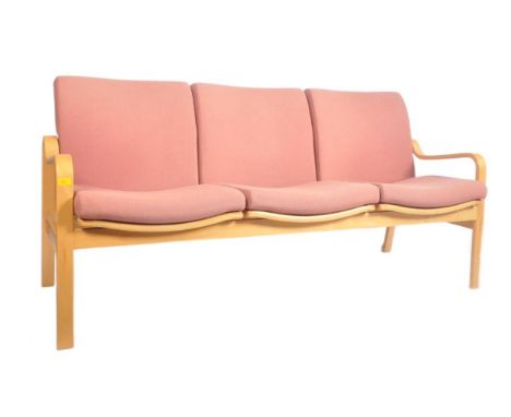 A vintage 20th century circa 1970s beech three-seater sofa settee. The sofa having a beech structure with straight back rest 