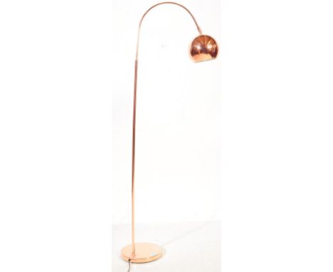A contemporary chrome rose gold / copper effect floor standard standing lamp light. Having a tubular column support with an a