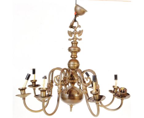 A 20th century Dutch style gilt brass eight branch chandelier / light fitting. Having eight scrolling branches extending from
