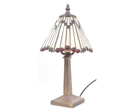 A contemporary Tiffany style desk table lamp light. With finial top into lead style glass shade, into a square tapering colum