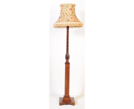 A 1930's Art Deco large oak standard floor lamp. Raised on squared terraced&nbsp; base with square and pierced column upright