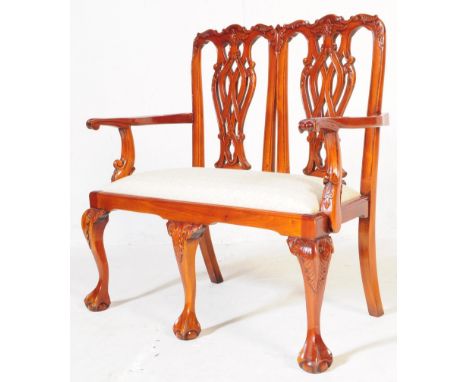 A Chippendale revival small proportion child's two seater saloon window seat sofa settee. Having carved decoration with inter