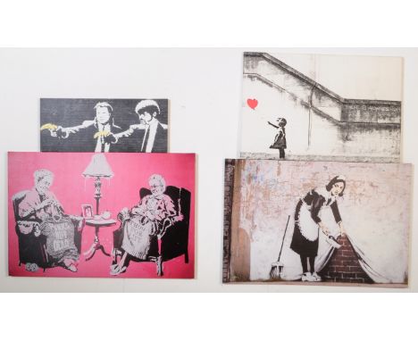 A collection of Banksy, stencil graffiti artist from Bristol. Four canvas prints of his work including, Pulp Fiction bananas,