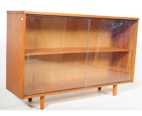 Avalon Furniture - A mid century teak wood bookcase by Avalon. Raised on shaped legs with wide open window bookcase having a 