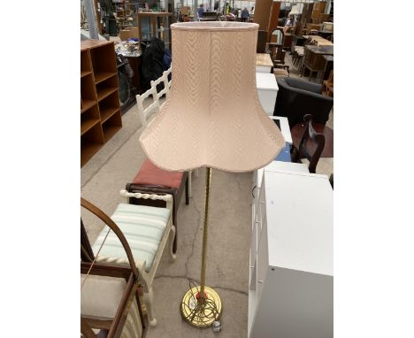 A MODERN BRASS STANDARD LAMP COMPLETE WITH SHADE
