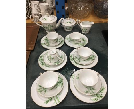 A JAPANESE TEASET WITH BAMBOO DESIGN TO INCLUDE A TEAPOT, SUGAR BOWL, CREAM JUG, CUPS, SAUCERS AND SIDE PLATES 