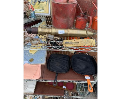 A BRASS MANUAL ACTION GREASE GUN BEARING THE LABEL 'THE ROYALTY GREASE PLUNGER', TWO BRASS MAGNIFYING GLASSES BEARING THE NAM