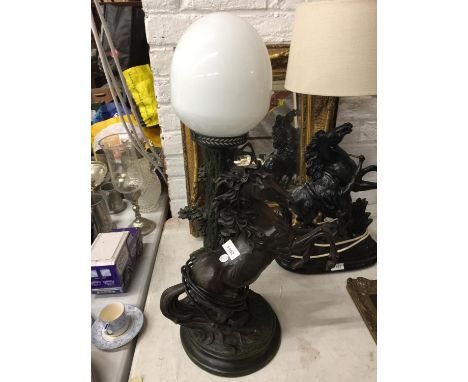 A REPRODUCTION RESIN MARLEY HORSE LAMP WITH WHITE GLASS SHADE 