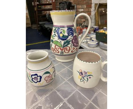 A POOLE POTTERY HAND PAINTED JUG, CUP AND VASE 