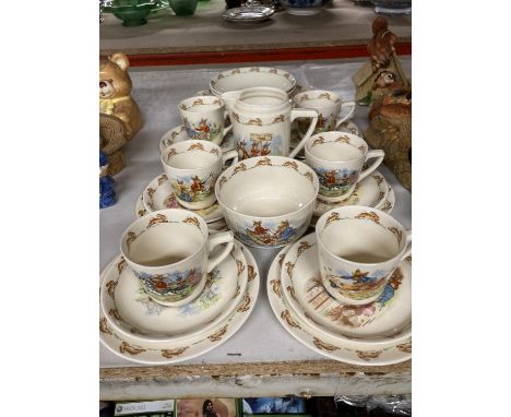 A LARGE COLLECTION OF ROYAL DOULTON 'BUNNYKINS' TEAWARE TO INCLUDE CUPS AND SAUCERS, BOWLS, PLATES, CREAM JUG, SUGAR BOWL, ET