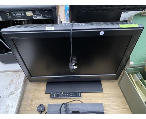 A SONY 26" TELEVISION WITH REMOTE CONTROL 