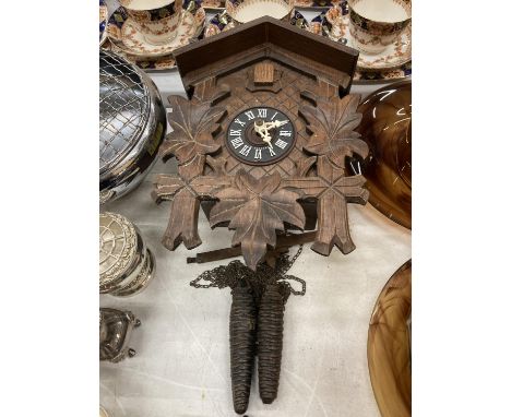 A GERMAN BLACK FOREST STYLE CUCKOO CLOCK 