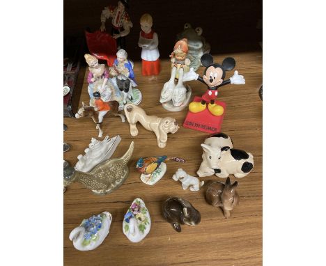 A QUANTITY OF CERAMIC FIGURES TO INCLUDE A SYLVAC DOG, GOEBEL GIRL WITH GEESE, MICKEY MOUSE, LOCH NESS MONSTER, RABBITS, CONT