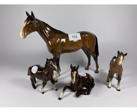 A GROUP OF FOUR CERAMIC HORSE MODELS, BESWICK RACEHORSE, TWO BESWICK FOALS AND DOULTON FOAL 