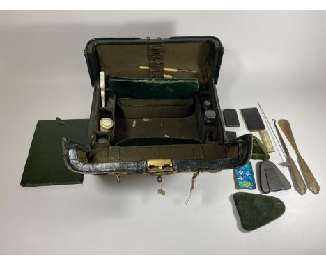 A VINTAGE 1940'S LEATHER TRAVELLING CASE CONTAINING VARIOUS HALLMARKED SILVER TOPPED ITEMS, HIP FLASK ETC 