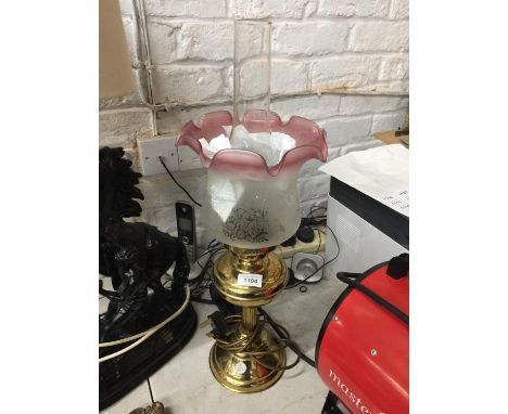 A BRASS VICTORIAN STYLE OIL LAMP WITH FROSTED GLASS  SHADE AND GLASS FUNNEL 