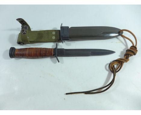 A UNITED STATES M3 FIGHTING KNIFE IN A M8A1 SCABBARD, 16CM BLADE 