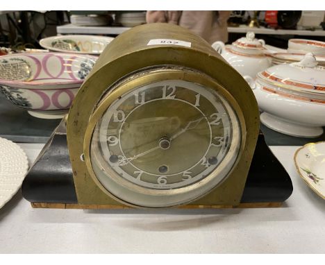 AN ART DECO BRITISH CHIMING MANTLE CLOCK WITH PENDULUM AND 'SILENT' SWITCH TO THE FACE 