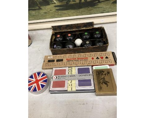 A VINTAGE SET OF CARPET BOWLS, CRIBBAGE BOARD COMPLETE WITH PEGS, A VINTAGE PACK OF LINEN FINISH PLAYING CARDS, PLAYING CARDS