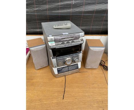 A SONY STEREO SYSTEM WITH 3 CD CHANGER, TAPE DECK AND TWO SHARP SPEAKERS 