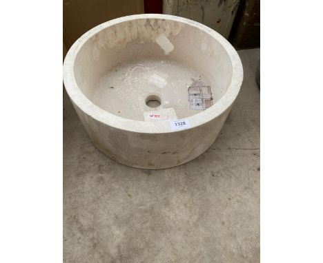 A SOLID CREAM CIRCULAR MARBLE WASH BASIN 