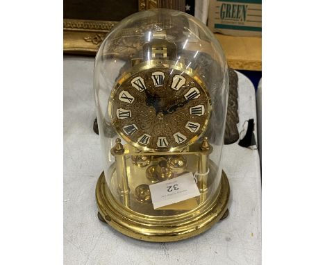 A 1950'S BRASS CASED 'KUNDO' ANNIVERSARY CLOCK WITH GLASS DOME 