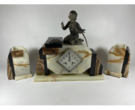 AN ART DECO MANTLE CLOCK WITH GIRL WITH BIRD FINIAL DESIGN AND SIDE GARNITURES 