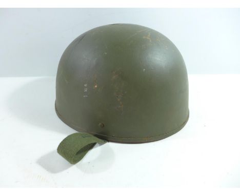 A GREEN PAINTED PARATROOPERS TYPE METAL HELMET AND LINER 