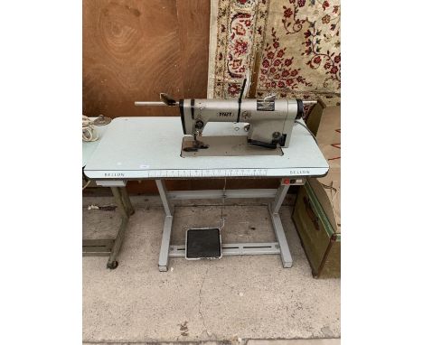 A VINTAGE PFAFF INDUSTRIAL SEWING MACHINE WITH TREADLE BASE 