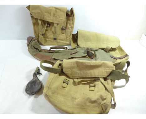 FOUR ITEMS OF MID 20TH CENTURY WEBBING TO INCLUDE GUN SLIP CASE, BAG AND A LEATHER SHOT FLASK ETC (5) 