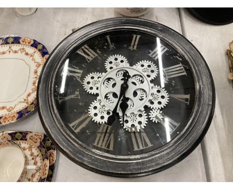 A WALL CLOCK WITH EXPOSED MOVING PARTS DIAMETER 33CM 