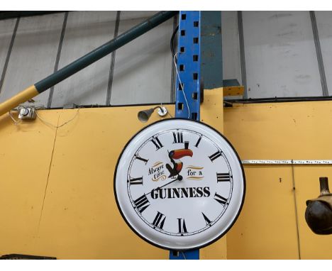 A METAL GUINNESS WALL CLOCK DIAMETER 40CM 