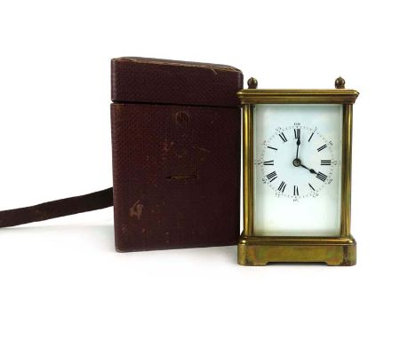 A 19th century carriage clock, the movement striking on a gong, the enamelled face with Roman and Arabic numerals, within a b