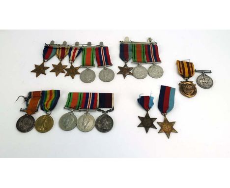 A large group of First and Second World War medals including a QEII Long Service and Good Conduct Medal awarded to 571034 Ch.