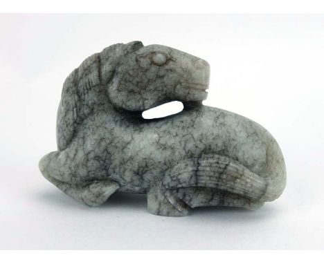 A Chinese mottled grey jade carving modelled as a resting pony, l. 6.5 cm