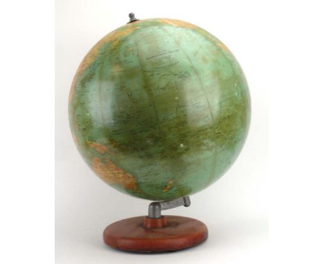 A mid-20th century paper globe on stand, overall h. 66 cm CONDITION REPORT: Some losses to paper. 