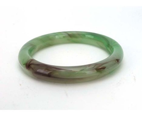 A green/purple jade bangle, internal d. 6.1 cm