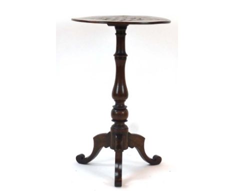 A Victorian walnut tripod table, the surface inset with a tooled leather games board, d. 44 cm